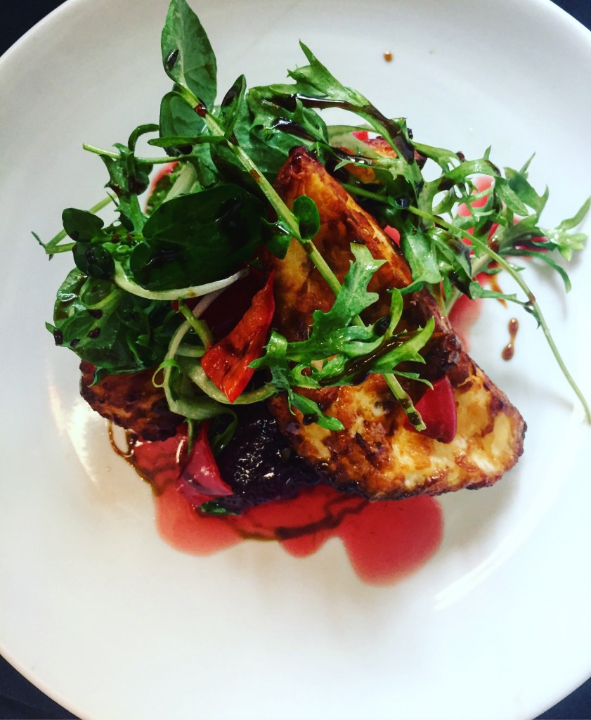 Halloumi with Strawberries, Pickled Chilies, and Carob Molasses