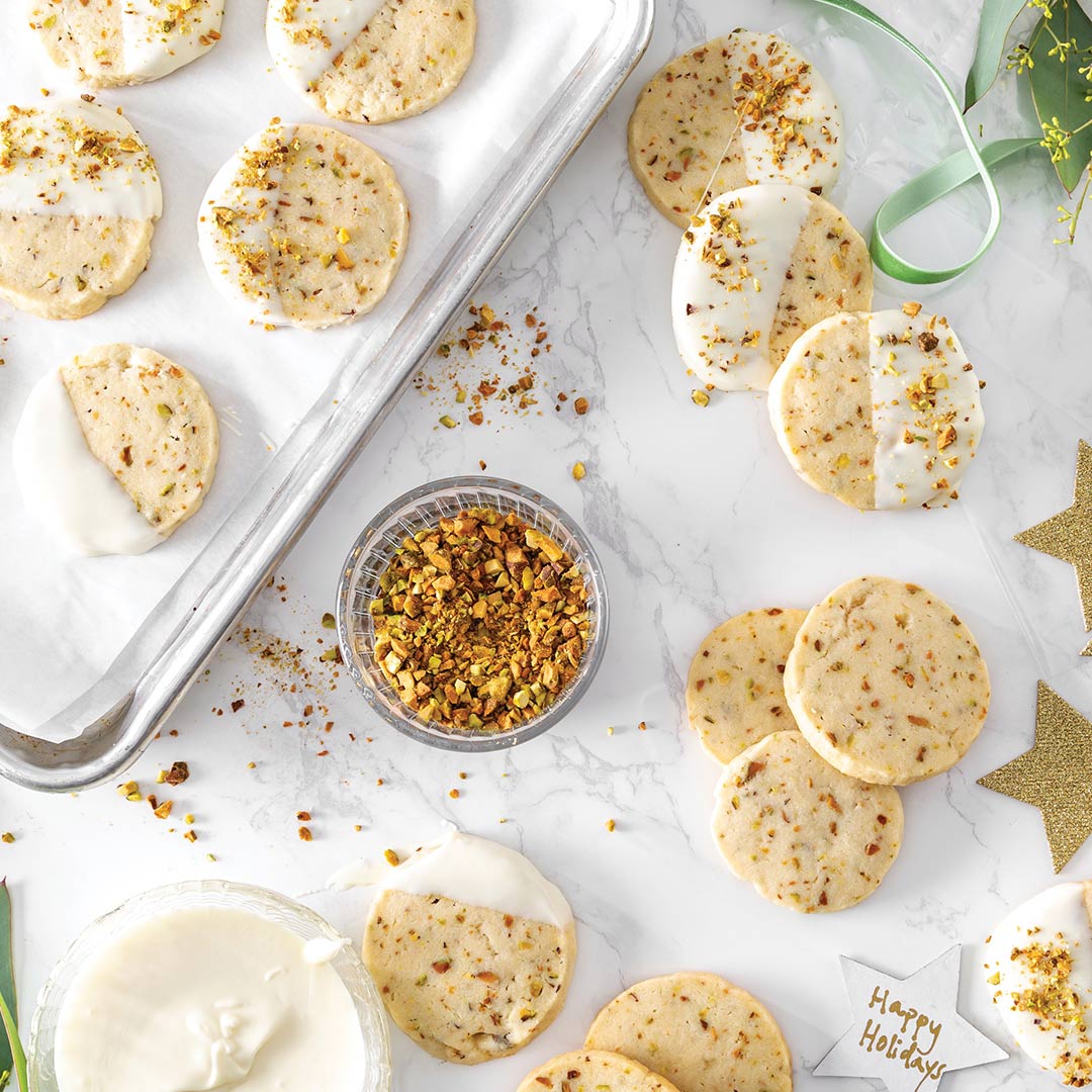 Pistachio White Chocolate Shortbread Cookies - Louisiana Cookin' A combination of salted pistachios and white chocolate gives these cookies a delicious sweet and salty flavor. Pistachio White Chocolate Shortbread Cookies Makes 20 Ingredients 1 cup unsalted butter, softened ⅓ cup confectioners’ sugar ¼ cup granulated sugar ¼ teaspoon kosher salt 1 egg yolk, room temperature 1 teaspoon vanilla extract 2 cups all-purpose Pistachio White Chocolate Shortbread Cookies