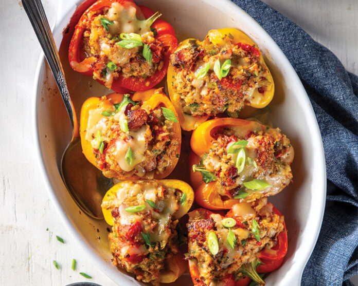 Our Boudin-Stuffed Bell Peppers are packed with a double wallop of boudin and bacon, baked to perfection, and topped with a sprinkle of cheese.