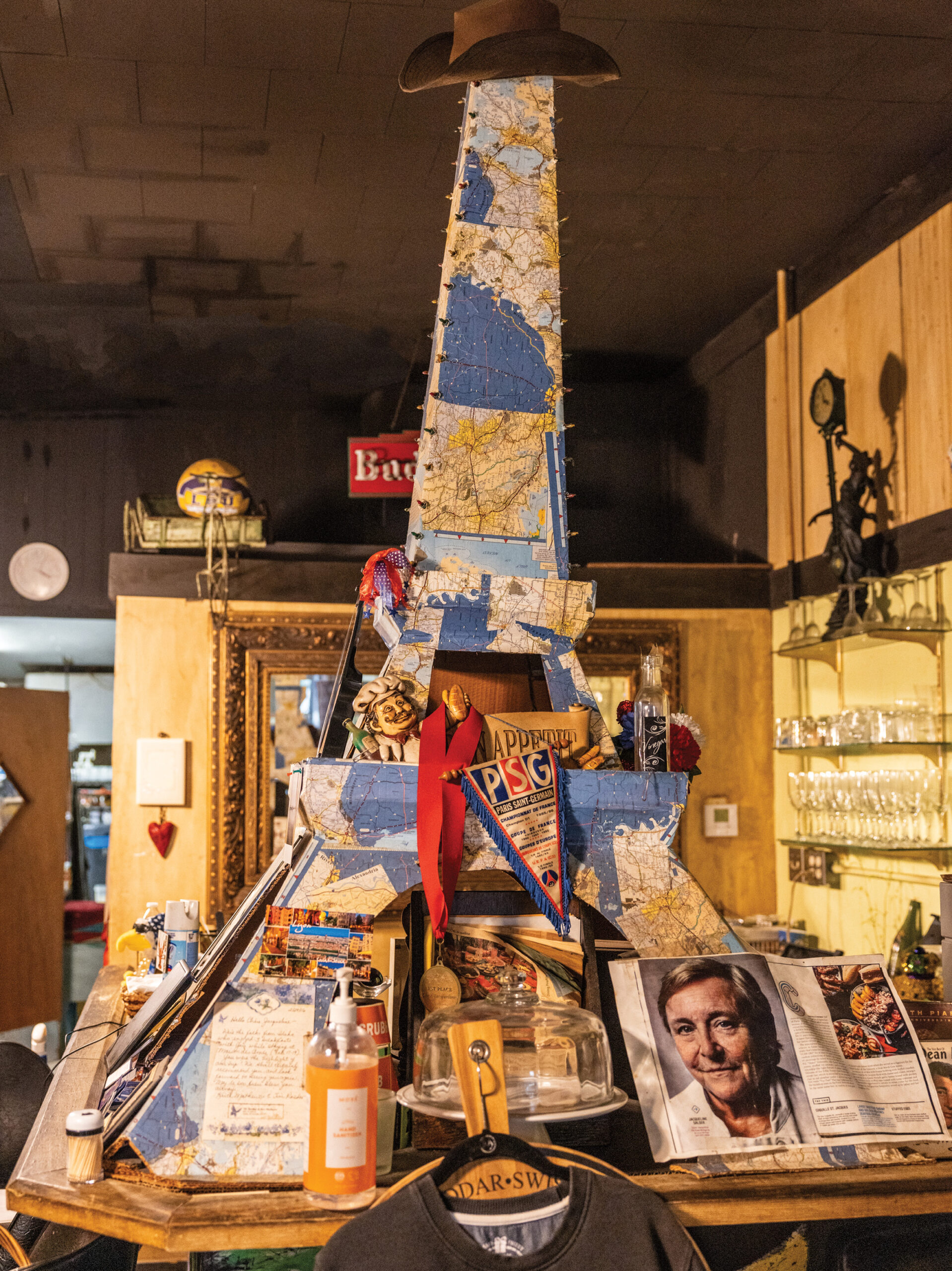 Experience French Cuisine with a Cajun Twist at Chez Jacqueline in Breaux Bridge - Louisiana Cookin' Text: Beth D'addano Photos: Kyle Carpenter Some Francophiles prefer white-tablecloth, fancy palaces of Gallic flavor—think Julia Child’s favorite, Chez Georges, a Parisian institution since 1926. Then there are the more casual family-style bistros that dish French fare in a relaxed setting. Chez Jacqueline is in that last number. To a first-timer, the restaurant is a Chez Jacqueline’s interior is decorated with faded press clippings, party menus, and family photos.